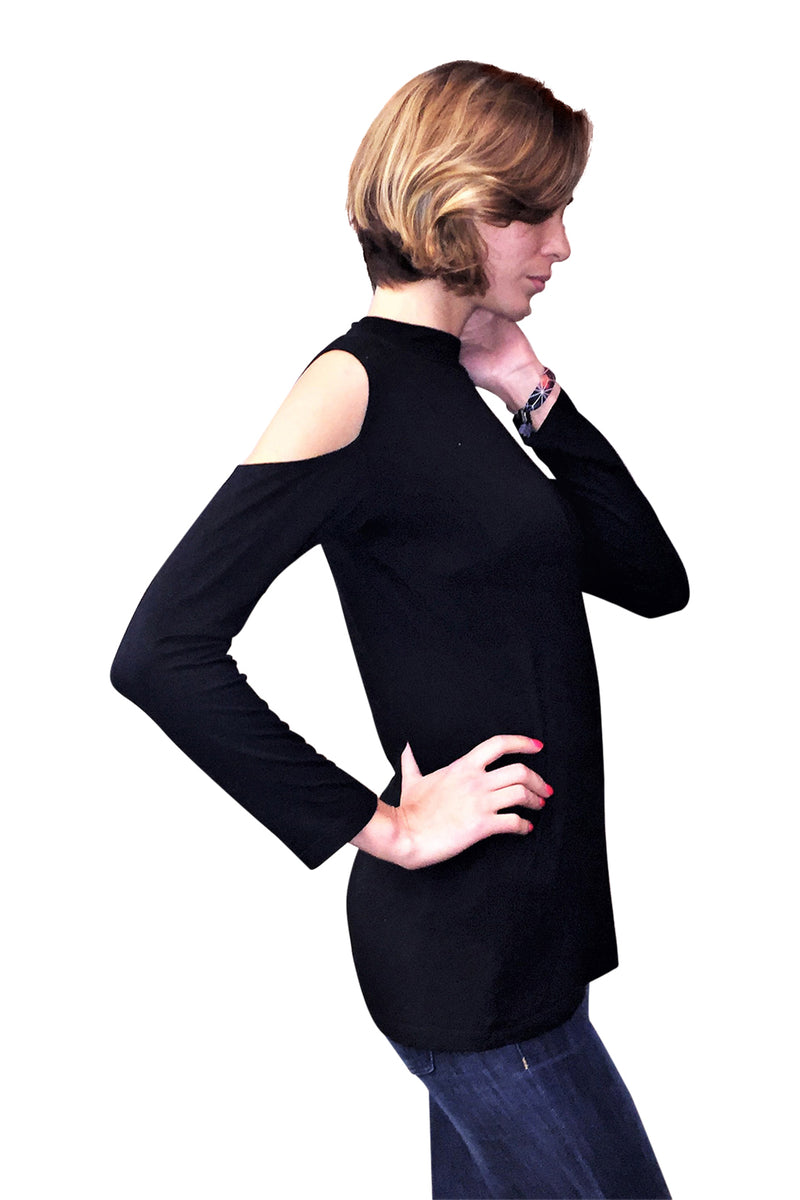 Long sleeve cold shoulder mock neck top in black and white stripes.