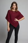 Ultra soft and lightweight one size asymmetrical poncho sweater wrap.