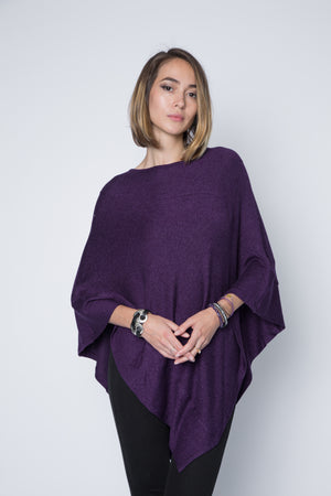 Ultra soft and lightweight one size asymmetrical poncho sweater wrap.