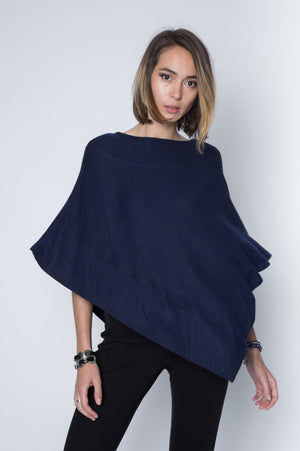 Ultra soft and lightweight one size asymmetrical poncho sweater wrap.