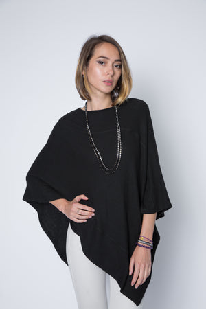 Ultra soft and lightweight one size asymmetrical poncho sweater wrap.