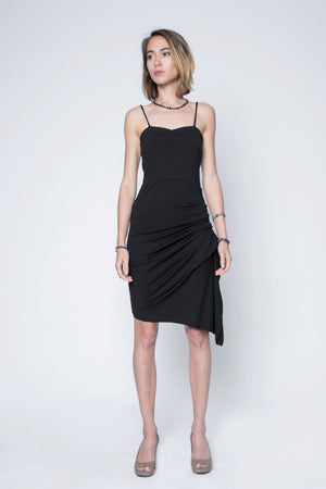 Strappy midi black dress with side rouge and asymmetric bottom.