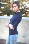 Long sleeve cold shoulder mock neck top in marine blue.